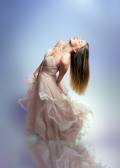 Elegant fashion. Stunning woman in elegant long dress in studio