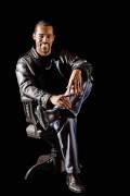 Portrait of cool latino man on black