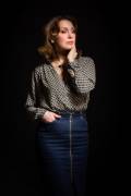 Low key fashion portrait of elegant woman over black background